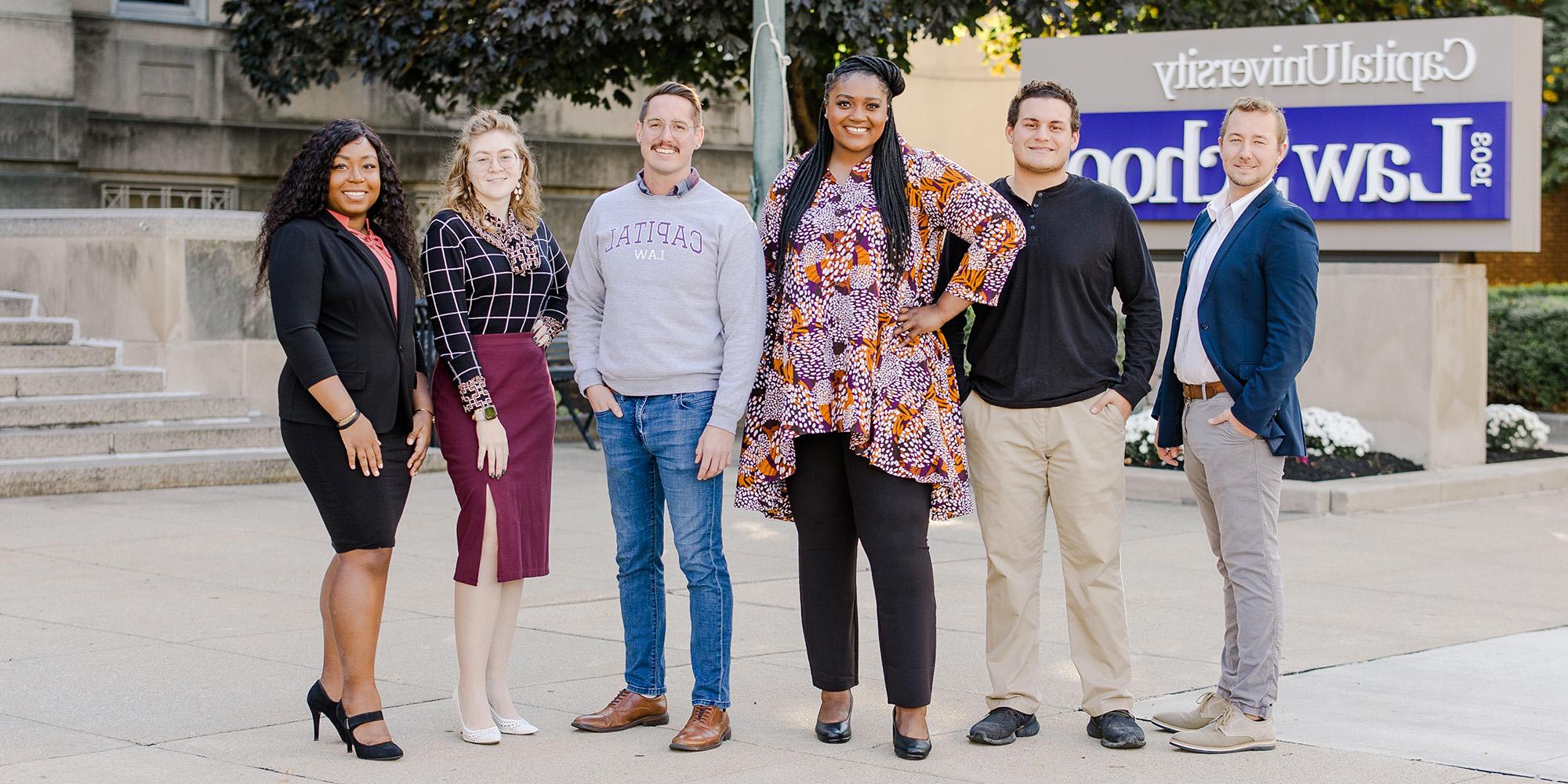 Students Standing In Front Of Law School